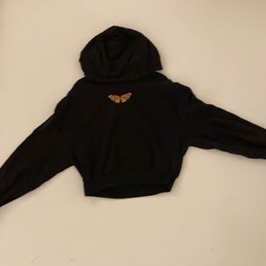 Cropped black butterfly sweater.